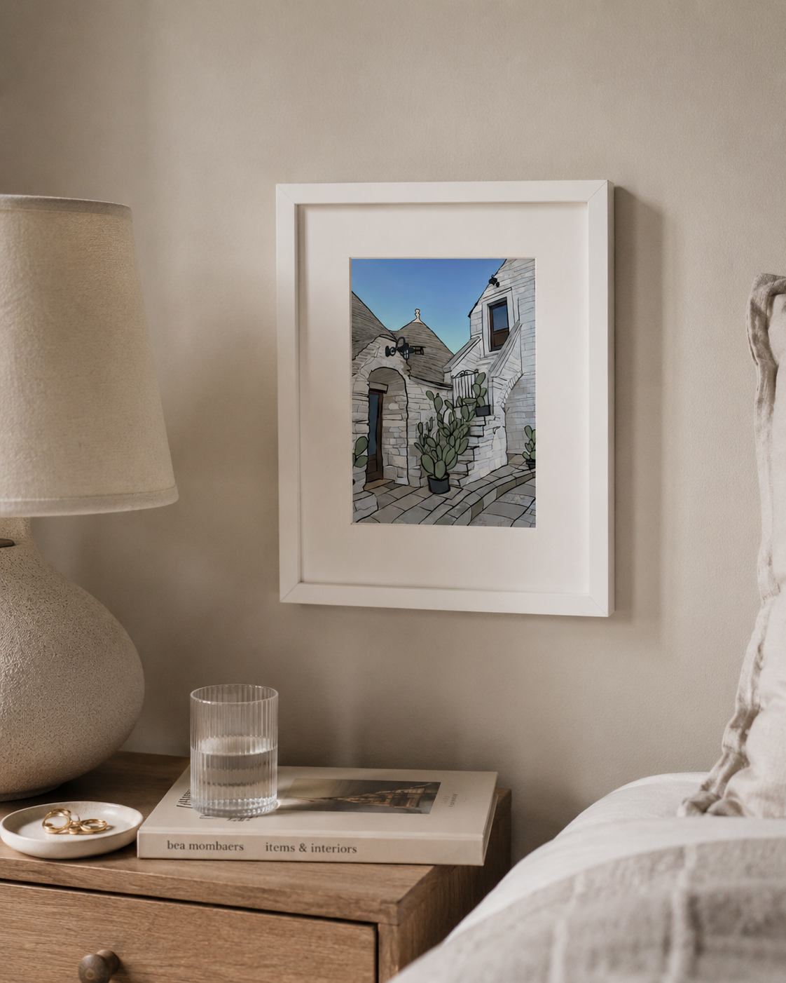 A4 Alberobello print framed close-up on a bedside table