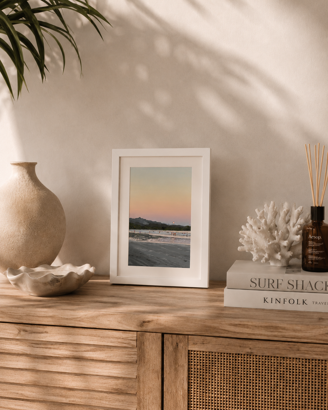 A4 Costa Rica print styled on a wooden console table with coral décor