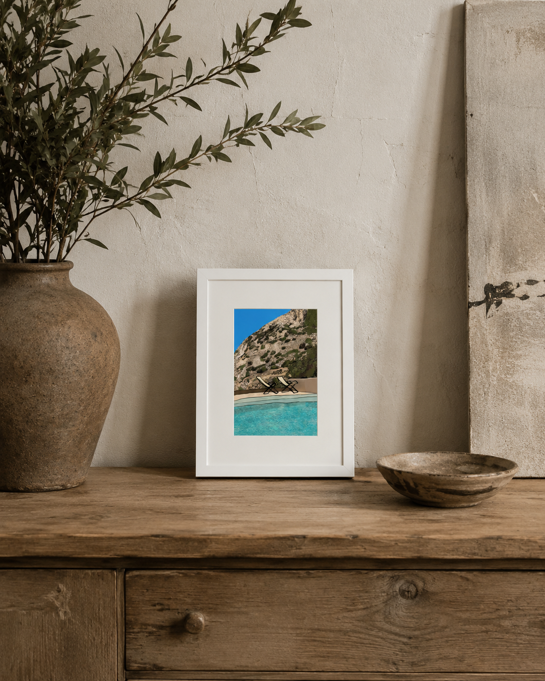 A5 Sifnos Chairs print styled on a rustic wooden table with a vase