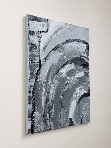 Argento - grey and white abstract acrylic painting on canvas, unframed against a wall, side angle