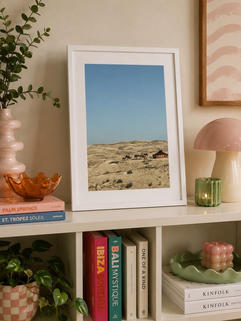 A3 Agafay Desert print leaning on a bookshelf with plants and ceramics