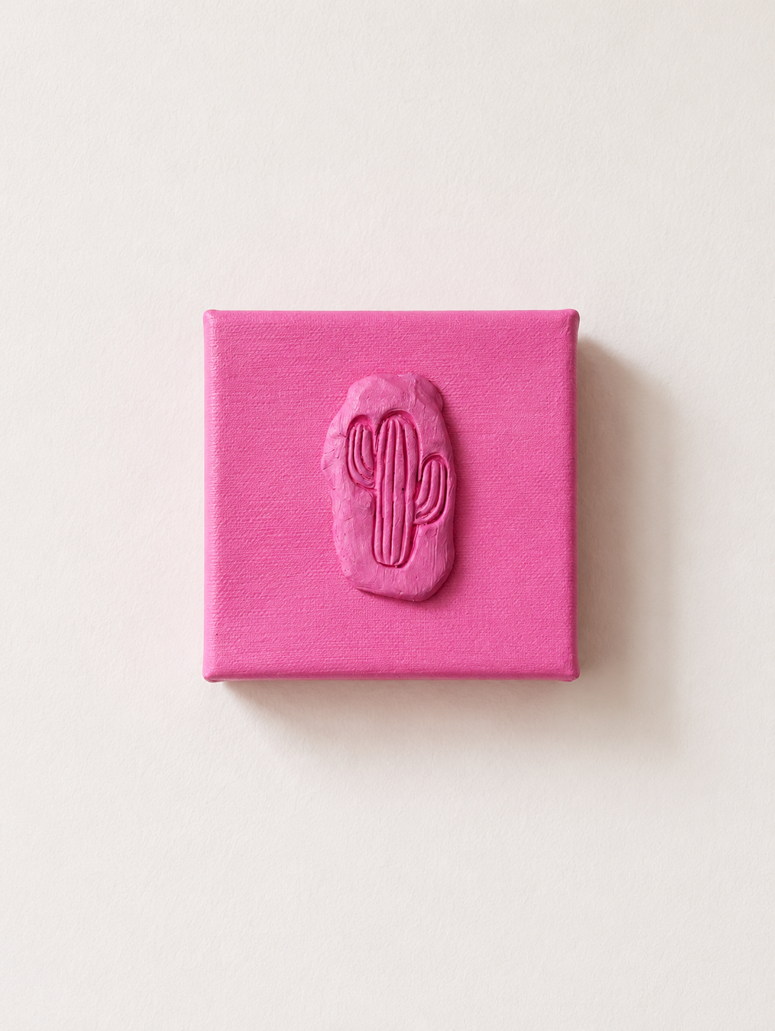 Cactus Rosa Grande — a small pink ceramic cactus emblem mounted on a pink box canvas, photographed against a plain white background.