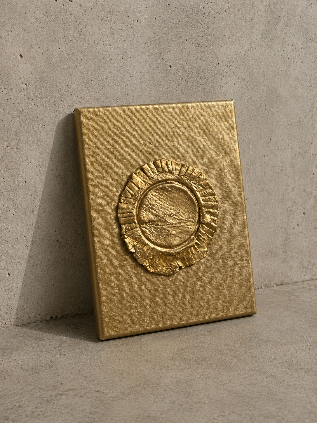 Eclipse ceramic art on gold canvas, raised metallic gold ruffled circular design
