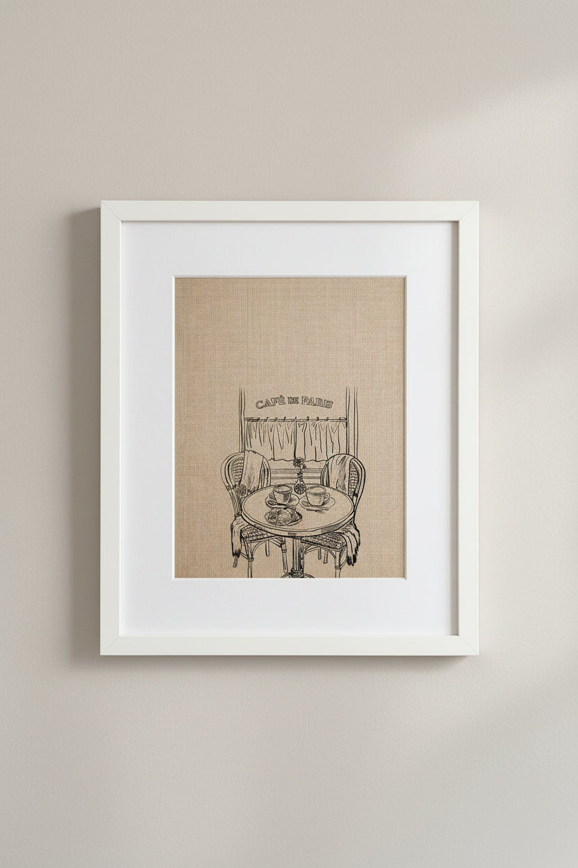 Framed Café de Paris print of a bistro table and chairs