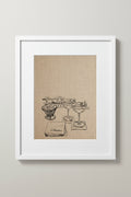 Framed Couple of Martinis print of cocktail glasses on a wall