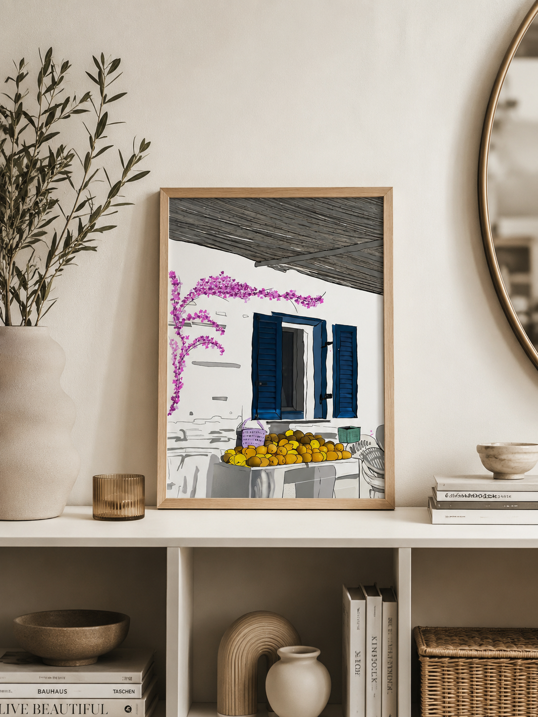 Milos print styled on a shelf with a plant, mirror, and books