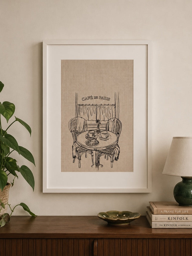 a4 Framed Café de Paris print of a bistro table and chairs over a console table