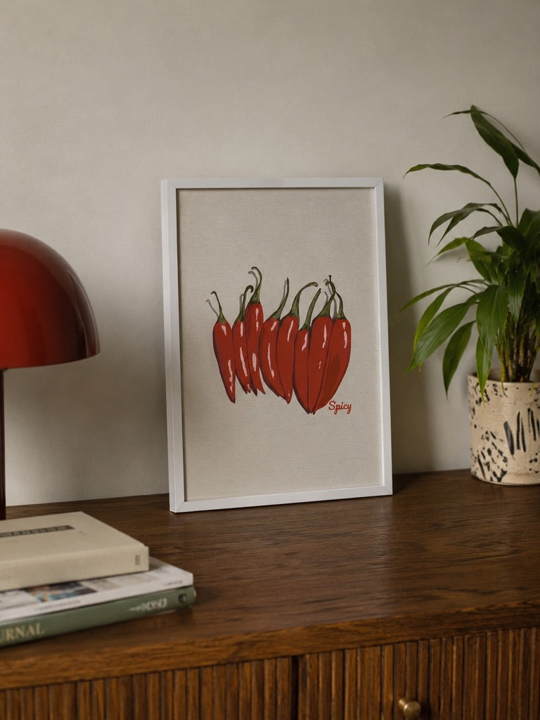 a4 Framed Picante print of red chilli peppers in a nice home