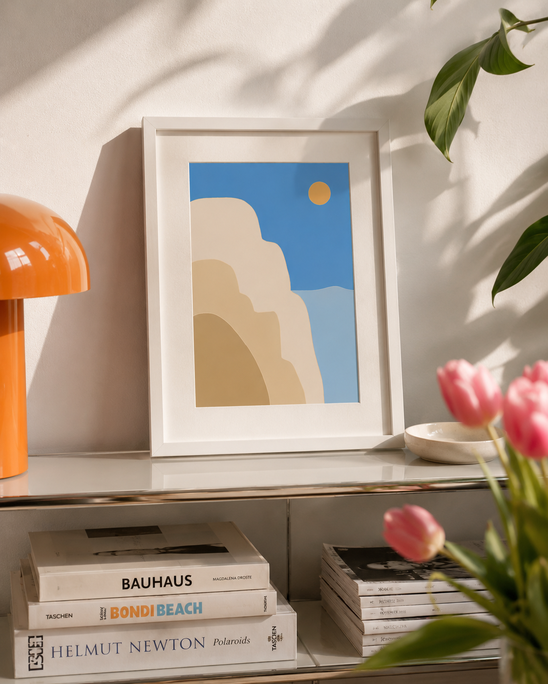 a4 Framed Santorini Sun print of abstract cliffs and sky on a console table